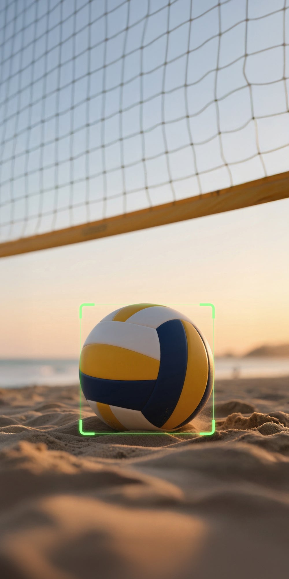 Beach volleyball on sand with net in background
