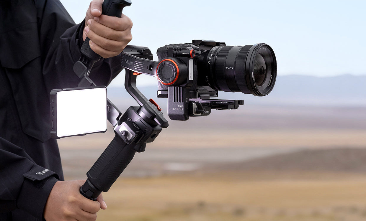 Camera on a gimbal stabilizer with a scenic background
